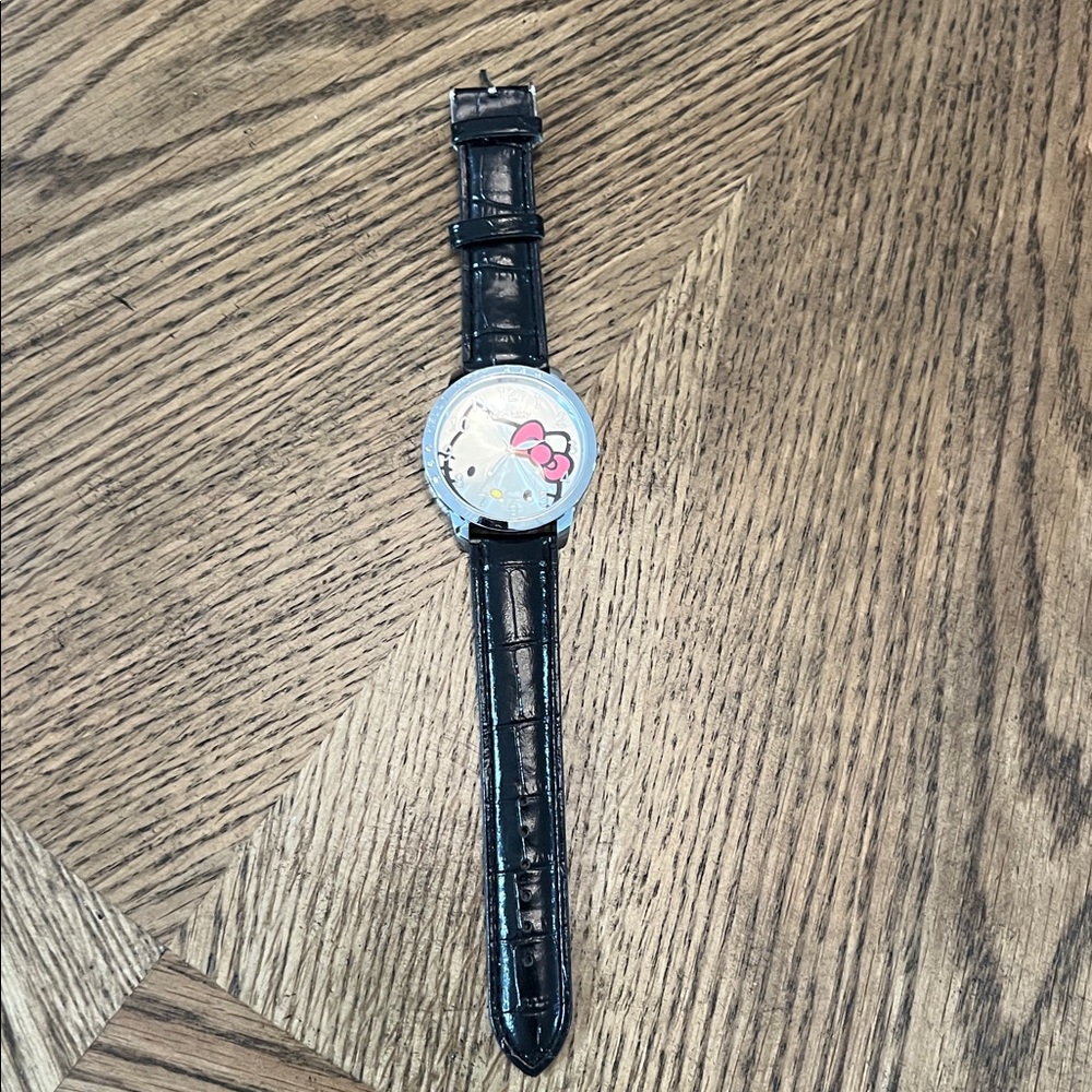 Hello Kitty leather strap watch. Need battery. Never worn.